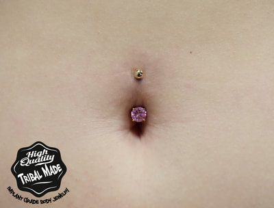 This Gold navel curve with prong set pink CZ's looks fantastic in this clients navel!